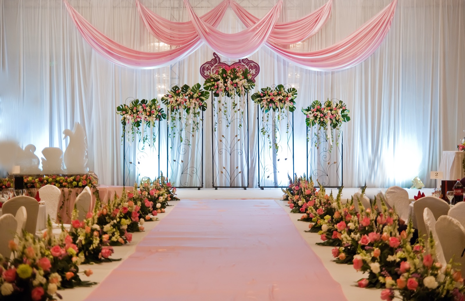 Banquet hall stage and floral aisle